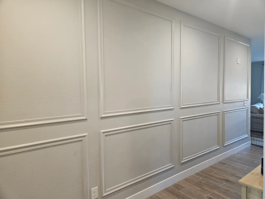 Applied panel molding on an accent wall, finish carpentry by Desert Forge Cabinets